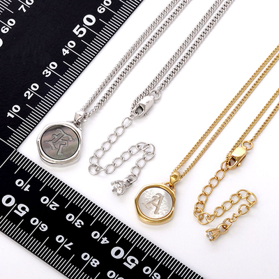 イニシャルシェルペアネックレス